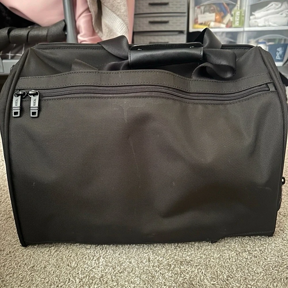 Tumi carry-on bag.